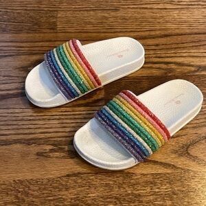 Girls flip flops size 13. Great condition. Has some wear left. Rainbow colors.